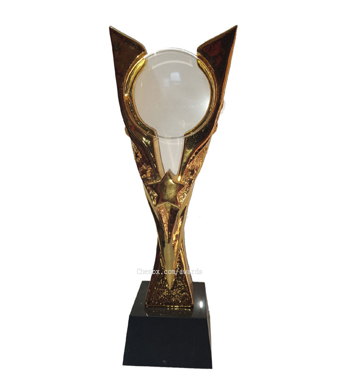 Gold color plaque with banding accent on the black base